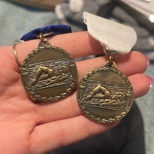 Two swimming pins!! One blue and one white :)